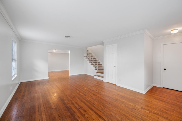 unfurnished room with crown molding and hardwood / wood-style floors