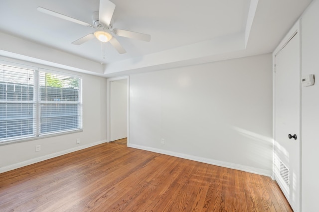 unfurnished room featuring hardwood / wood-style flooring and ceiling fan