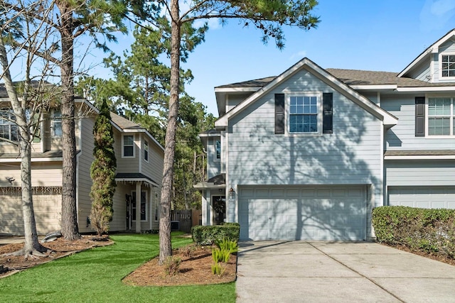 view of front of property featuring a garage and a front lawn