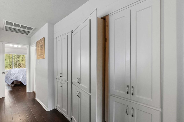 hall with dark wood-type flooring