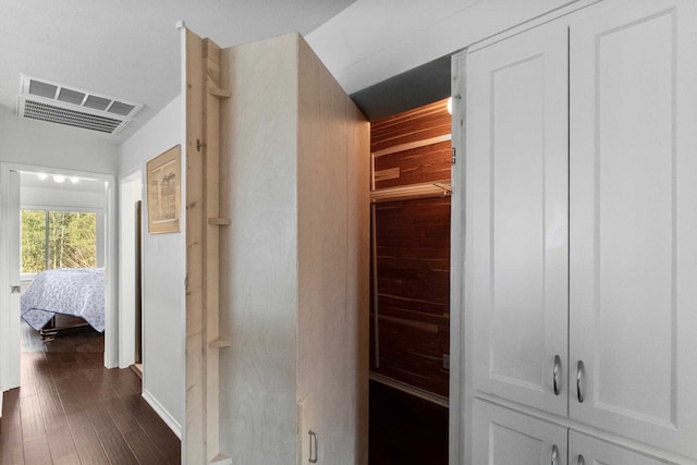 hallway featuring dark hardwood / wood-style flooring