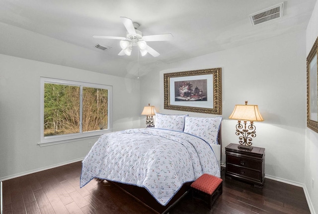 bedroom featuring ceiling fan and dark hardwood / wood-style floors