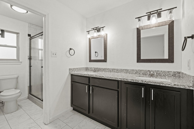 bathroom featuring vanity, toilet, and walk in shower