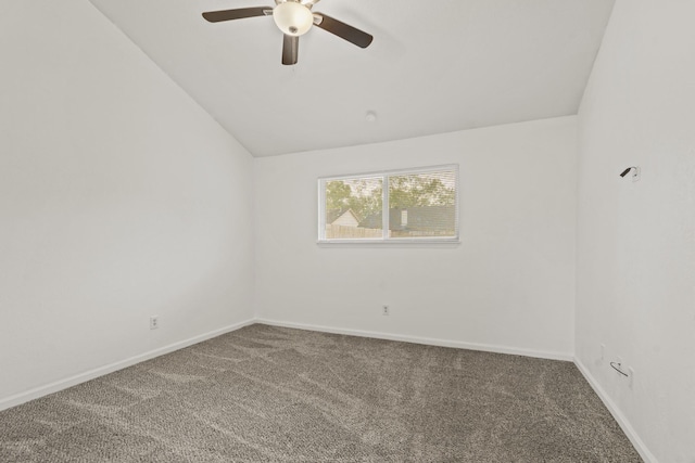 empty room with carpet flooring, ceiling fan, and vaulted ceiling