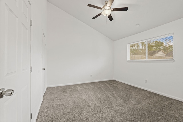 unfurnished bedroom with ceiling fan, carpet floors, and lofted ceiling