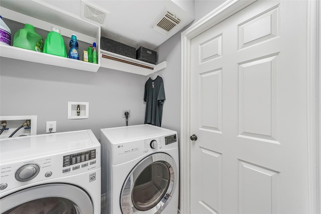 laundry area featuring washing machine and dryer