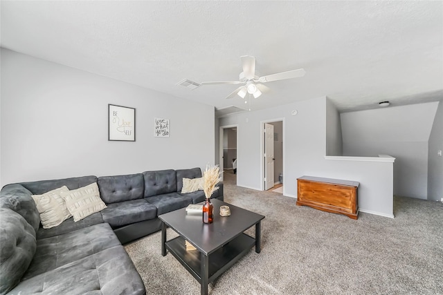 carpeted living room featuring a textured ceiling