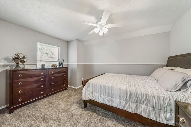 bedroom with light carpet, a textured ceiling, and ceiling fan