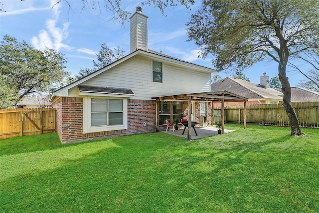 back of house with a patio and a lawn