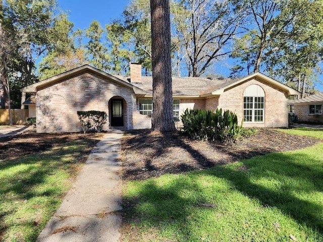 ranch-style home with a front yard