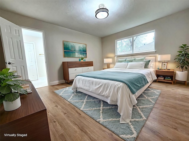 bedroom featuring light wood-type flooring