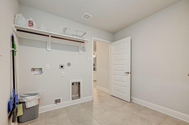 laundry area with electric dryer hookup, light tile patterned floors, and washer hookup