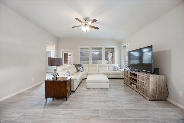 living room with ceiling fan and lofted ceiling