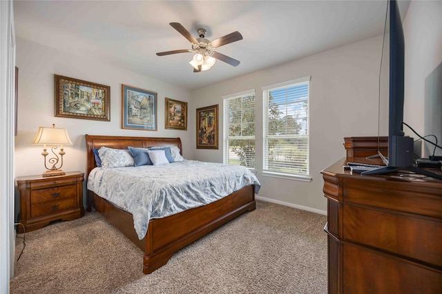 bedroom with light carpet and ceiling fan