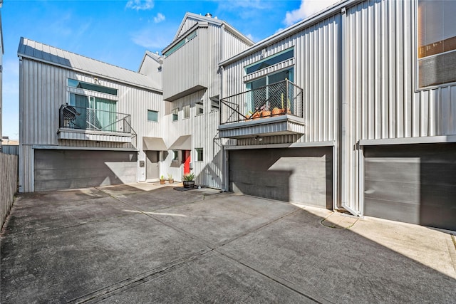 rear view of house featuring a garage