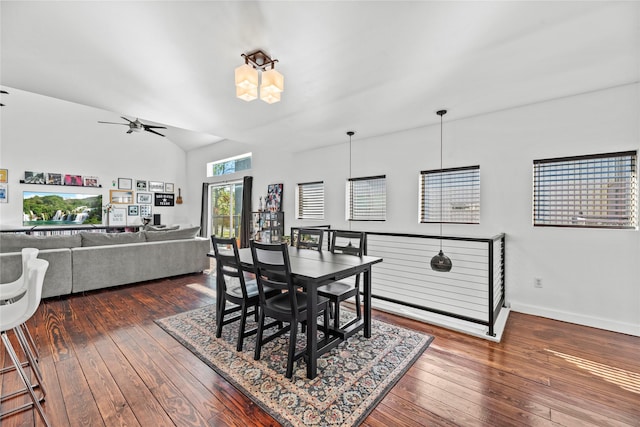 dining room featuring ceiling fan with notable chandelier and dark hardwood / wood-style flooring