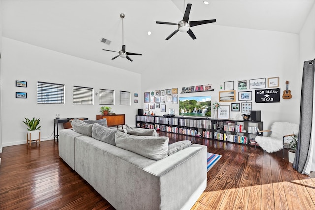 living room featuring ceiling fan, dark wood-type flooring, and high vaulted ceiling