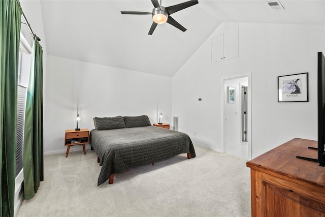 carpeted bedroom featuring ceiling fan and high vaulted ceiling