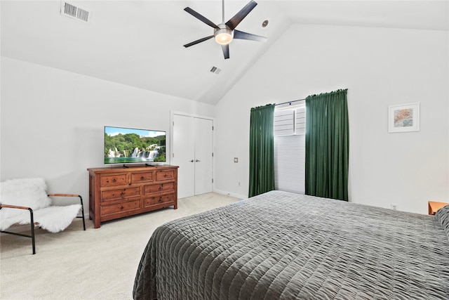 carpeted bedroom with high vaulted ceiling and ceiling fan