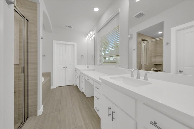 bathroom with plus walk in shower and vanity