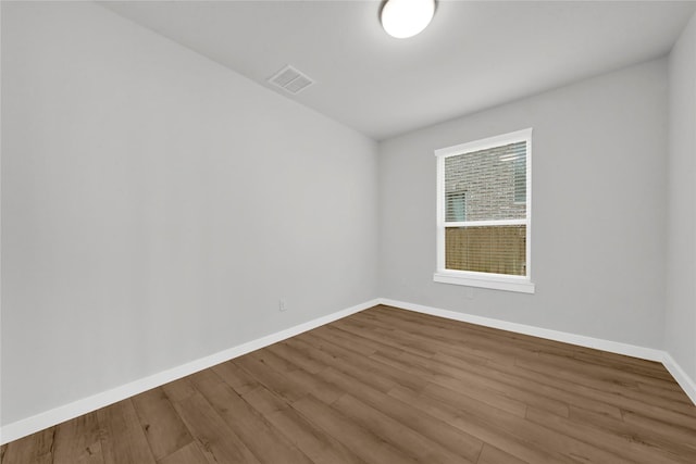 unfurnished room featuring hardwood / wood-style floors