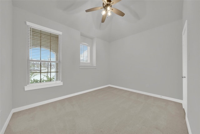 empty room featuring ceiling fan and carpet floors