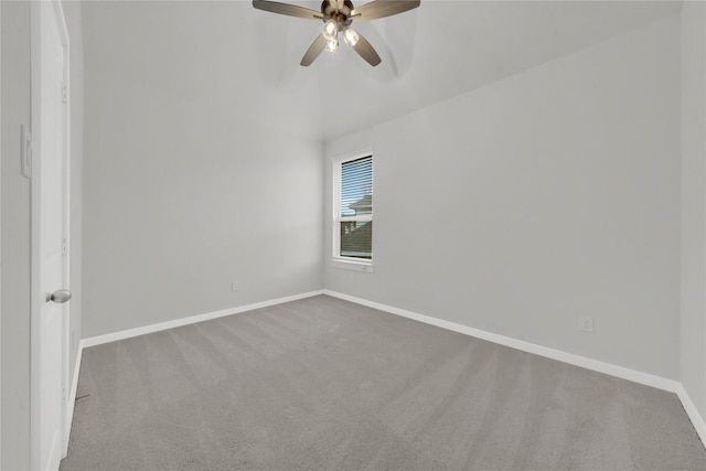 carpeted empty room featuring ceiling fan