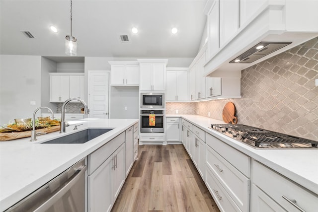 kitchen featuring white cabinetry, appliances with stainless steel finishes, and sink