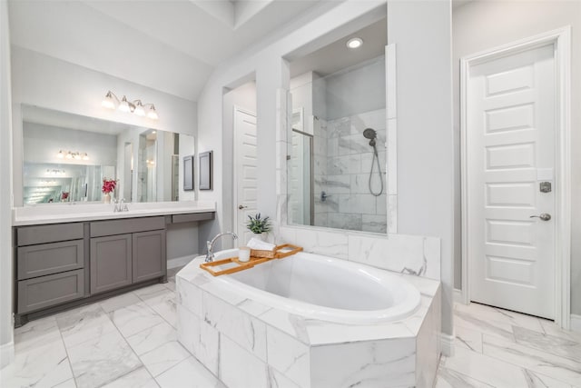 bathroom featuring plus walk in shower and vanity