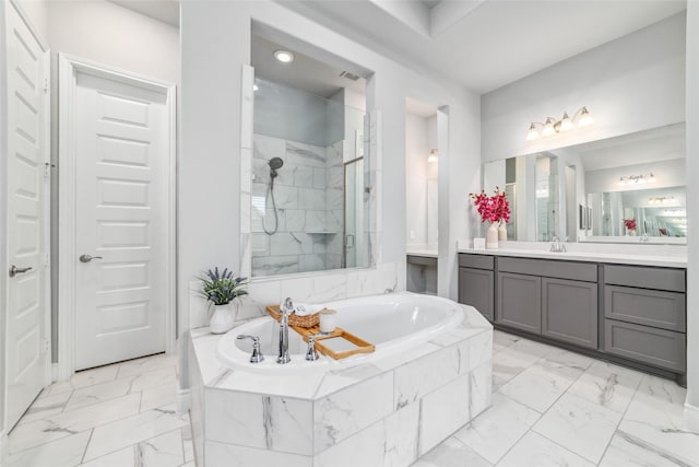 bathroom with independent shower and bath and vanity