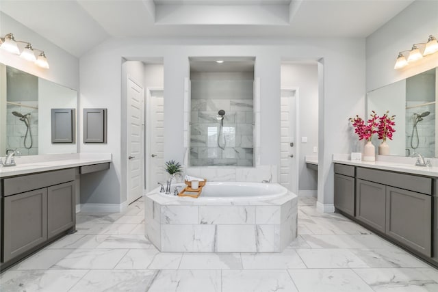 bathroom featuring vanity and plus walk in shower