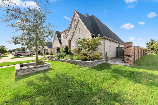 view of property exterior with a lawn