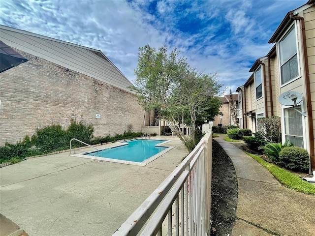 view of pool featuring a patio