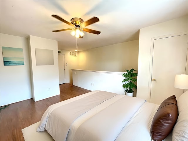 bedroom featuring ceiling fan and dark hardwood / wood-style flooring