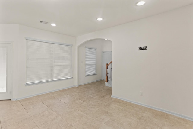 empty room with light tile patterned flooring