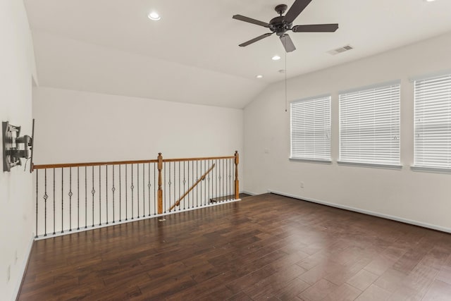 bonus room featuring ceiling fan, dark hardwood / wood-style floors, and vaulted ceiling