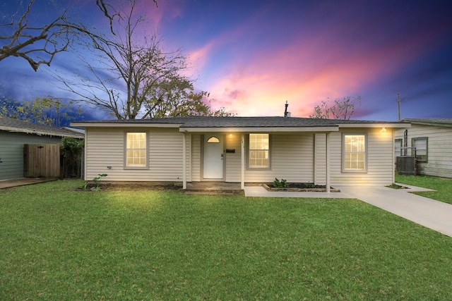 single story home featuring a yard