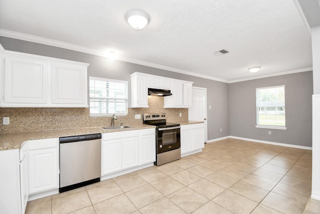 kitchen with backsplash, sink, light tile patterned flooring, white cabinetry, and stainless steel appliances