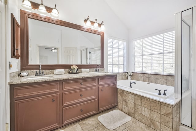 bathroom featuring vaulted ceiling, vanity, ceiling fan, and plus walk in shower