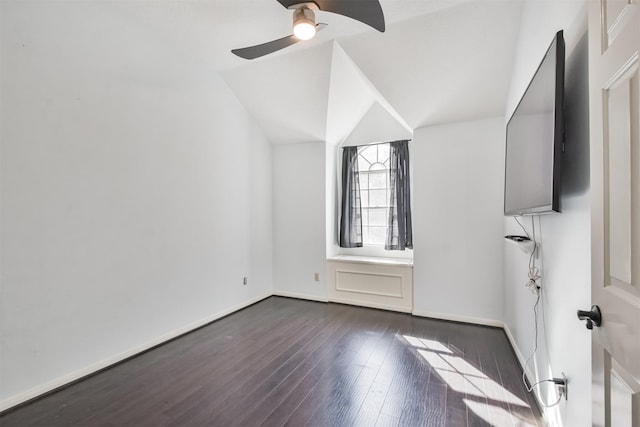 additional living space featuring lofted ceiling, dark wood-type flooring, and ceiling fan