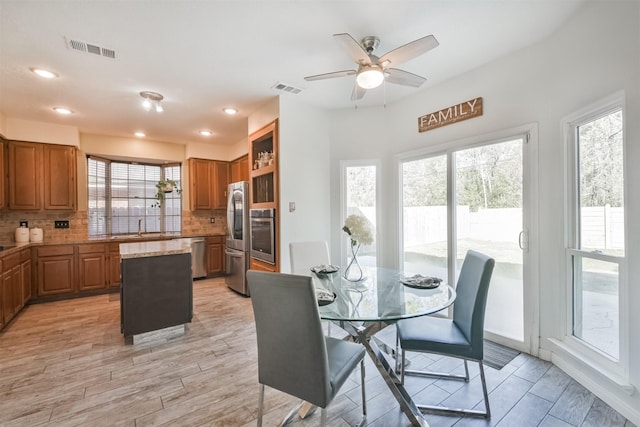 dining room with sink and ceiling fan