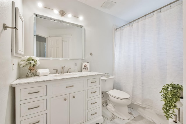 full bathroom with vanity, shower / tub combo with curtain, and toilet