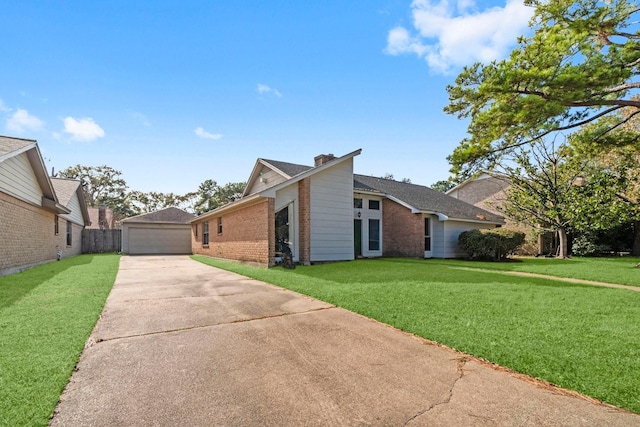 view of front facade with a garage and a front lawn