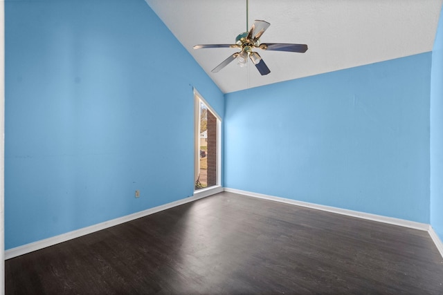 empty room featuring ceiling fan, dark hardwood / wood-style flooring, and vaulted ceiling