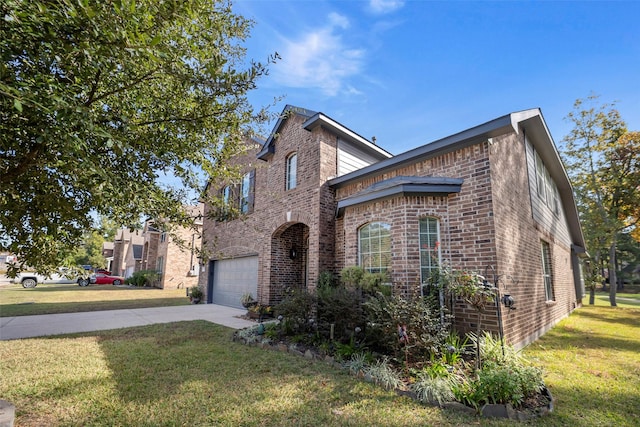 view of front of home with a garage and a front lawn