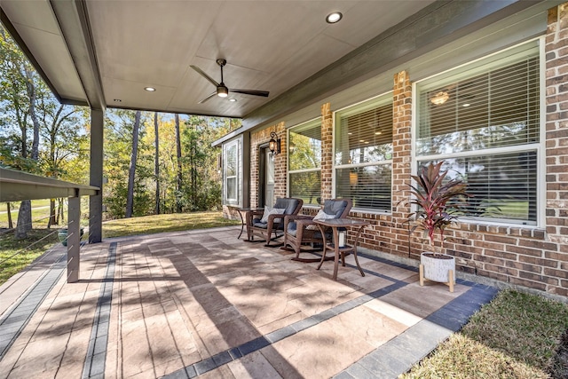 view of patio featuring ceiling fan