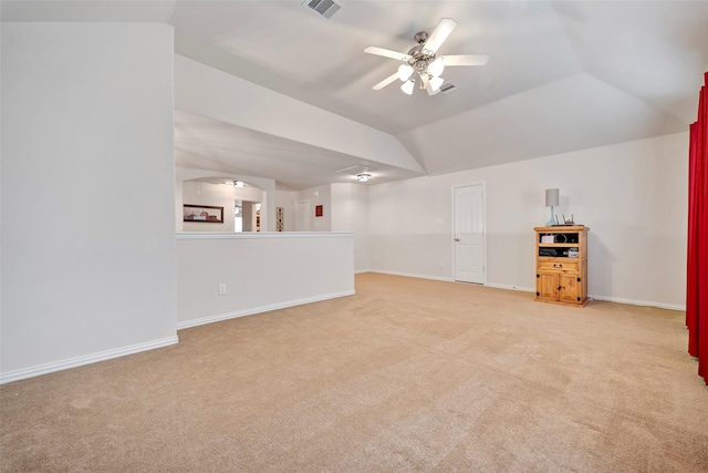 unfurnished living room with light colored carpet, ceiling fan, and lofted ceiling