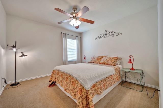 bedroom featuring ceiling fan and carpet