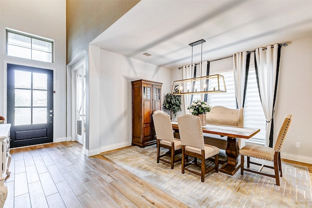 dining area with light wood-type flooring