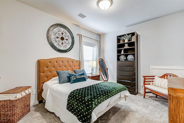 bedroom featuring light carpet